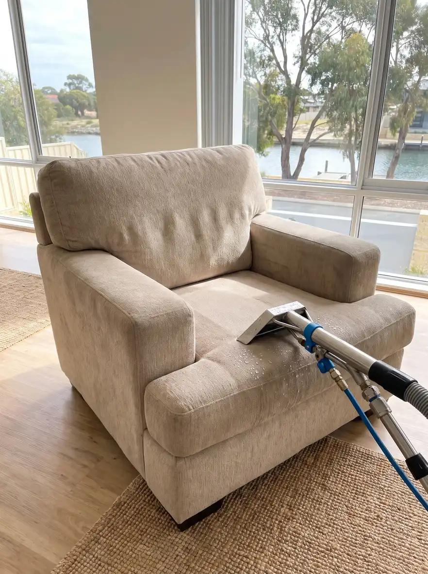 Freshly cleaned upholstered armchair with upholstery cleaning wand in a Mandurah home